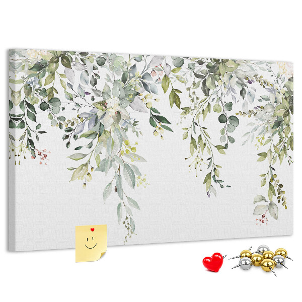 Korktafel mit Motiv aus grünen Blättern und zarten Blüten