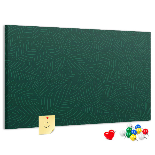 Korktafel mit Motiv grüne Blätter auf dunklem Hintergrund