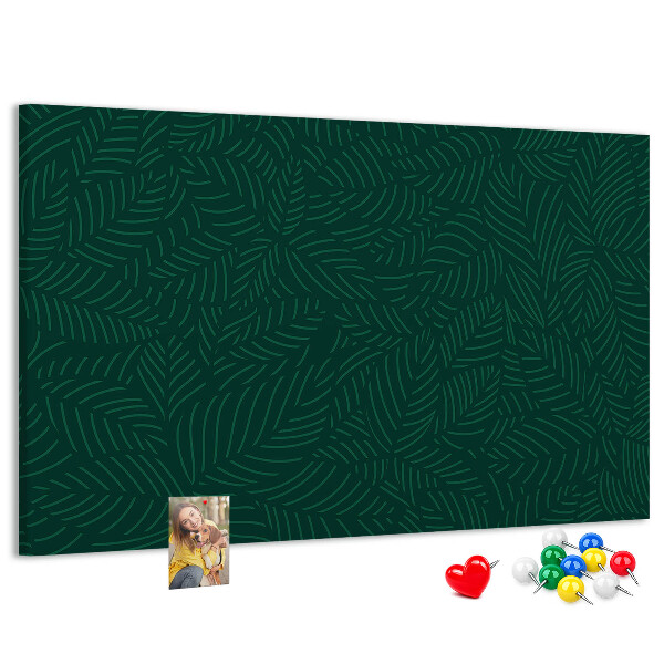 Korktafel mit Motiv grüne Blätter auf dunklem Hintergrund