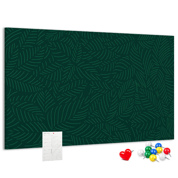 Korktafel mit Motiv grüne Blätter auf dunklem Hintergrund