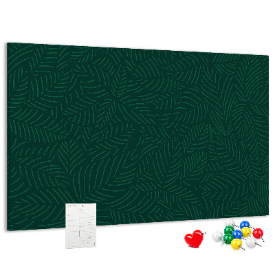 Korktafel mit Motiv grüne Blätter auf dunklem Hintergrund