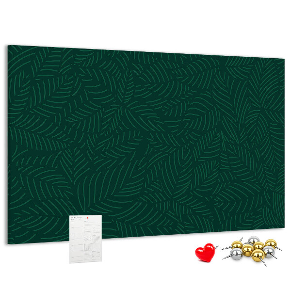 Korktafel mit Motiv grüne Blätter auf dunklem Hintergrund