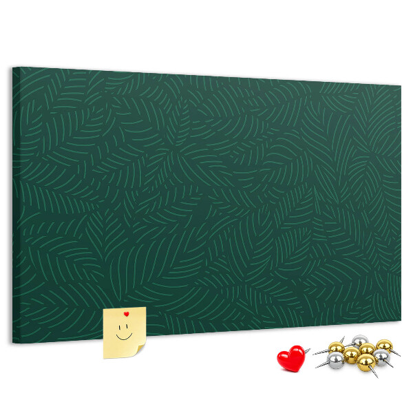 Korktafel mit Motiv grüne Blätter auf dunklem Hintergrund