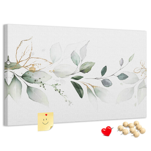 Korktafel mit zarten Blättern und goldenen Akzenten
