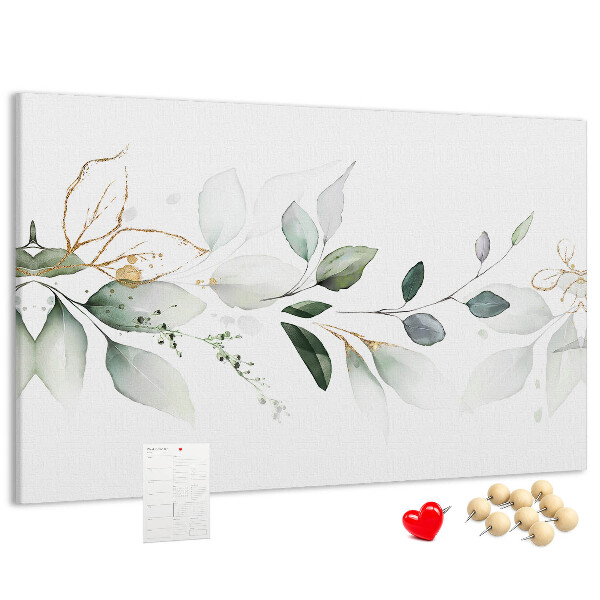Korktafel mit zarten Blättern und goldenen Akzenten