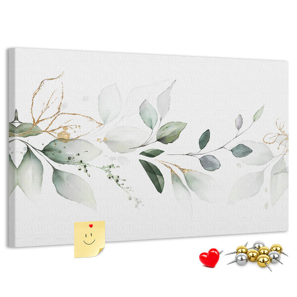 Korktafel mit zarten Blättern und goldenen Akzenten
