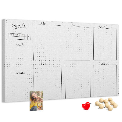 Planer mit Raster und Korkrückwand zur Organisation Ihrer Zeit