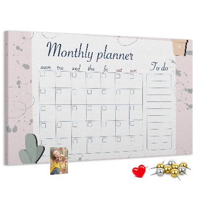 Korktafel mit Pflanzenmotiven als Monatsplaner