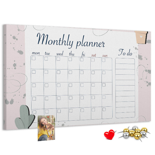 Korktafel mit Pflanzenmotiven als Monatsplaner