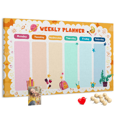 Korktafel mit farbenfrohem Schulmotiv als Wochenplaner