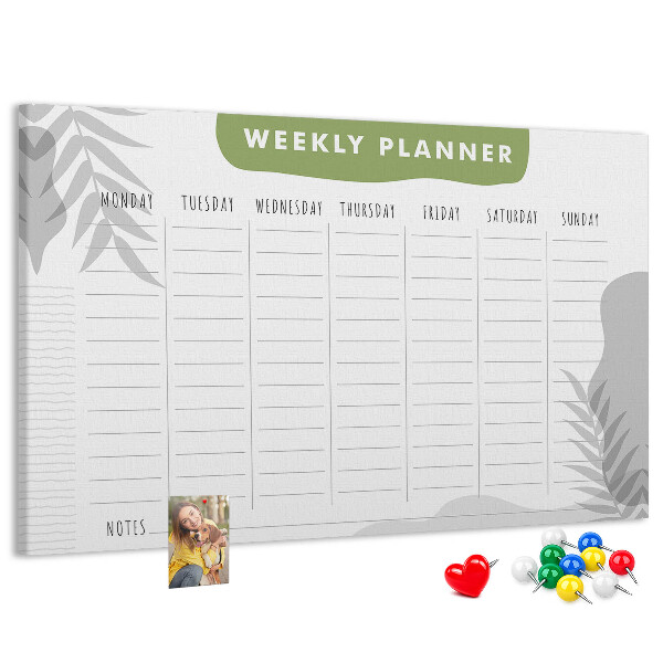 Korktafel mit Wochenplaner und Pflanzenmotiv