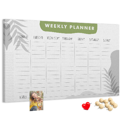 Korktafel mit Wochenplaner und Pflanzenmotiv