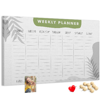 Korktafel mit Wochenplaner und Pflanzenmotiv