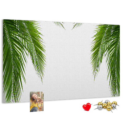 Korkbild mit Palmenblättern auf weißem Hintergrund