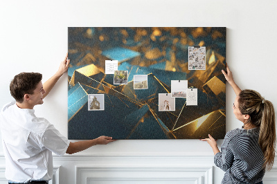 Korkpinnwand mit goldenen und blauen geometrischen Formen