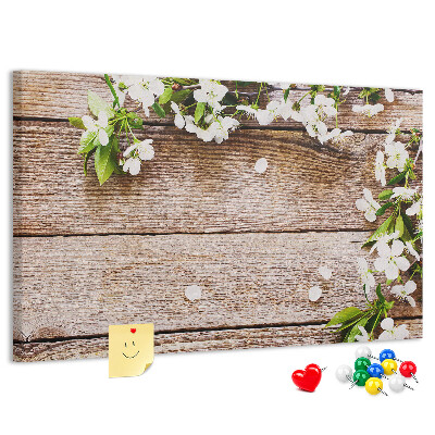 Korkbild mit Blumen auf einem Holzbrett-Hintergrund