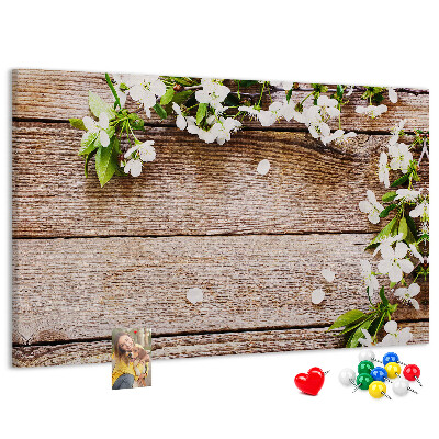 Korkbild mit Blumen auf einem Holzbrett-Hintergrund