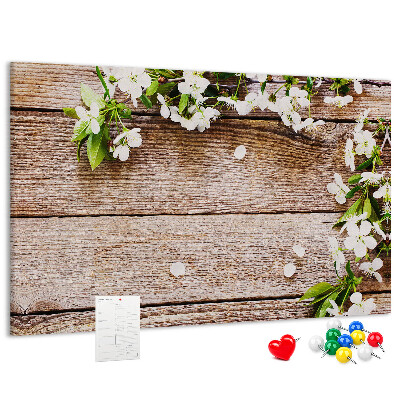 Korkbild mit Blumen auf einem Holzbrett-Hintergrund