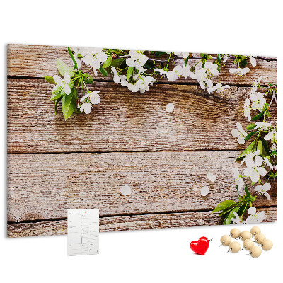 Korkbild mit Blumen auf einem Holzbrett-Hintergrund