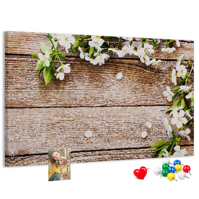 Korkbild mit Blumen auf einem Holzbrett-Hintergrund