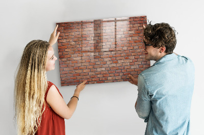 Schreib magnettafel Eine Notiztafel an einer Backsteinmauer
