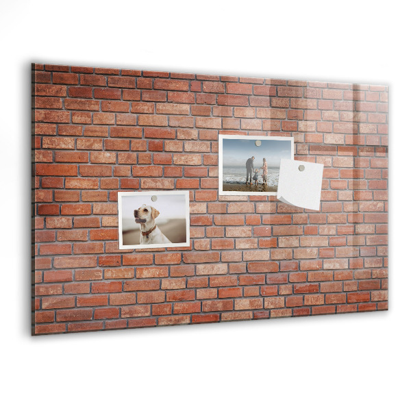 Schreib magnettafel Eine Notiztafel an einer Backsteinmauer